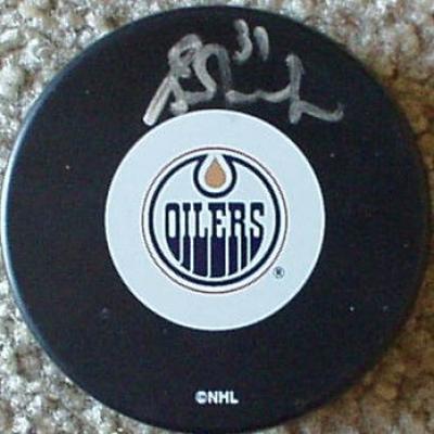 Grant Fuhr autographed Edmonton Oilers puck