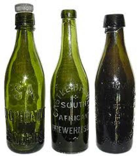 Bottles and Cans; The 2 left hand bottles were dug from a 1894 dump 