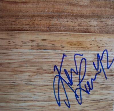 Kevin Love autographed basketball hardwood floor