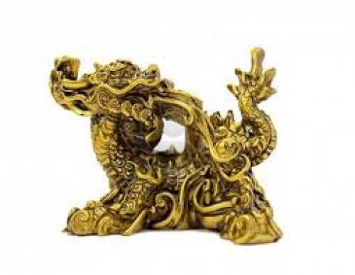 Decorative figurine golden dragon, a symbol of the year 2012