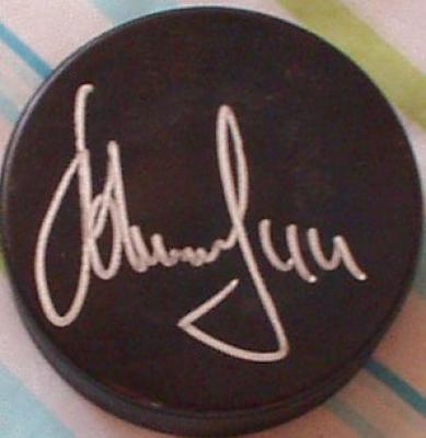 Alexei Zhitnik autographed hockey puck