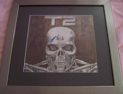Arnold Schwarzenegger autographed Terminator 2 embossed logo matted & framed